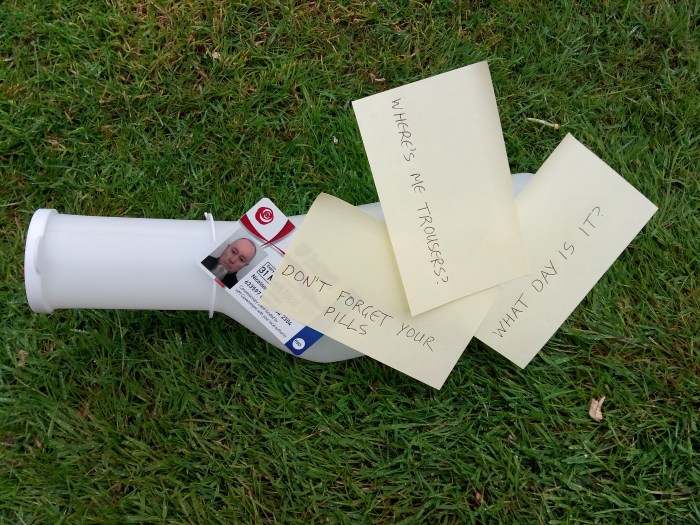 Out to Grass - an assemblage of past-it notes and bus pass on a green ground